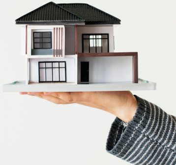 Hand presenting a model home on mobile